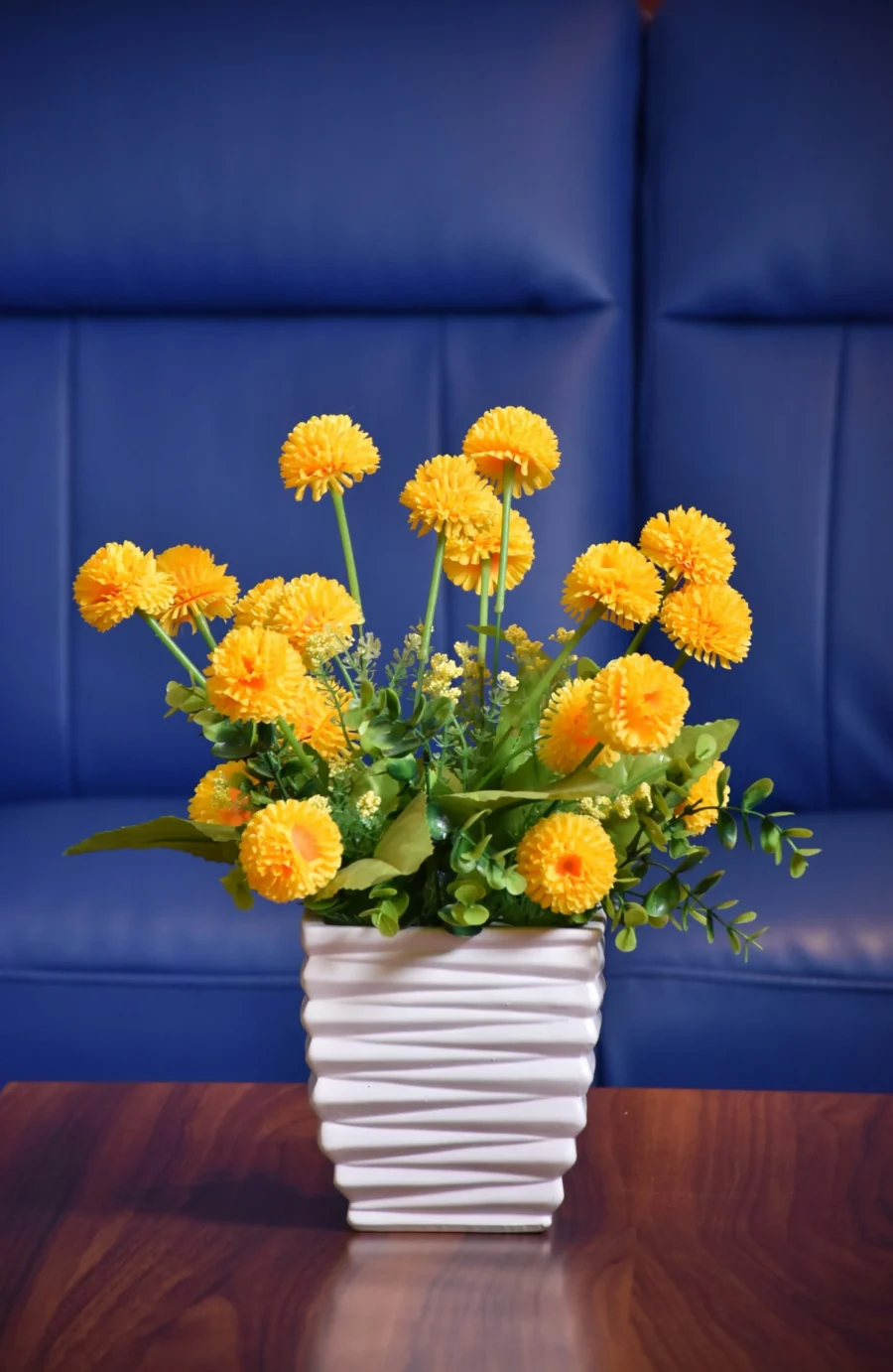 Artificial Yellow Marigold Flower Arrangement in White Wave Pot